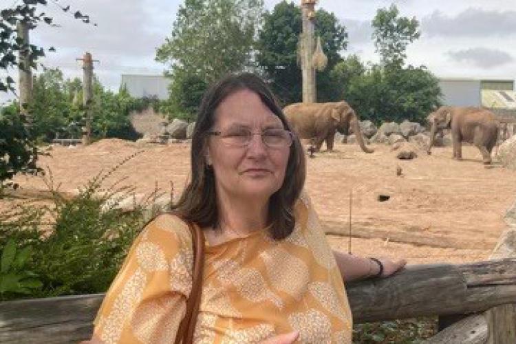 Resident, Jo, stood at Chester Zoo in front of elephants